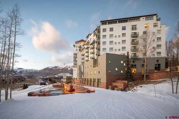 a dining table chair and window in a kitchen
