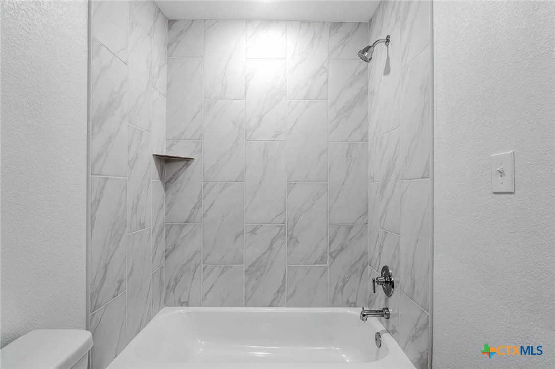 1924 Royal Loop Belton, TX 76513 - Photo 14 of 15 a bathroom with a shower and a toilet