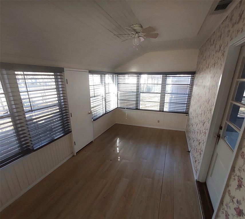 2131 Hubbard Street Paris, TX 75460 - Photo 11 of 14 a view of an empty room with wooden floor and a window