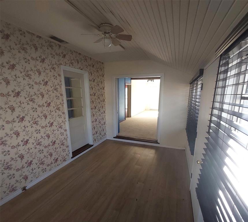 2131 Hubbard Street Paris, TX 75460 - Photo 12 of 14 a view of empty room with wooden floor and fan