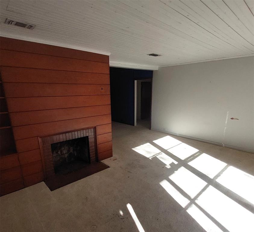 2131 Hubbard Street Paris, TX 75460 - Photo 4 of 14 a living room with furniture and a fireplace