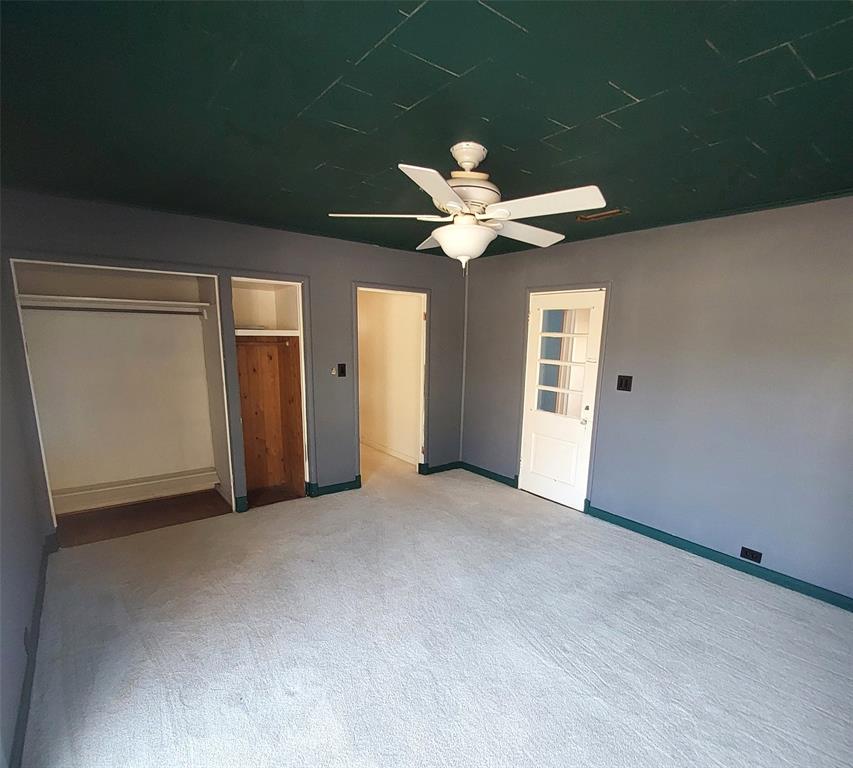 2131 Hubbard Street Paris, TX 75460 - Photo 7 of 14 a view of a room with a ceiling fan and a window