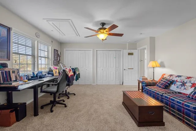 a bedroom with furniture and a chandelier