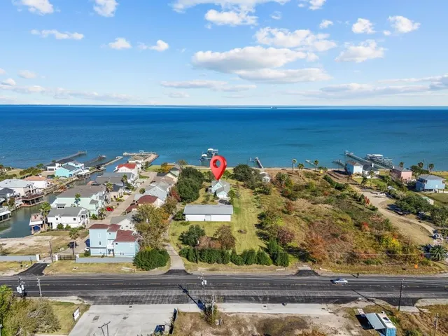a view of a swimming pool with a yard