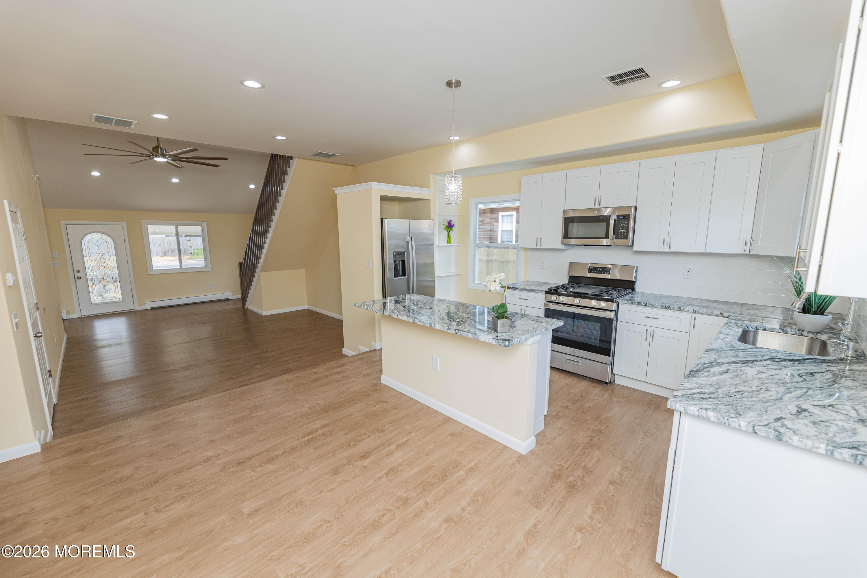 2408 Herbertsville Road Point Pleasant, NJ 08742 - Photo 16 of 82 a large kitchen with stainless steel appliances granite countertop a large counter top and a stove