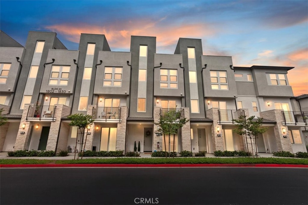1810 West Bushell Street Anaheim, CA 92805 - Photo 2 of 36 a front view of a multi story residential apartment building