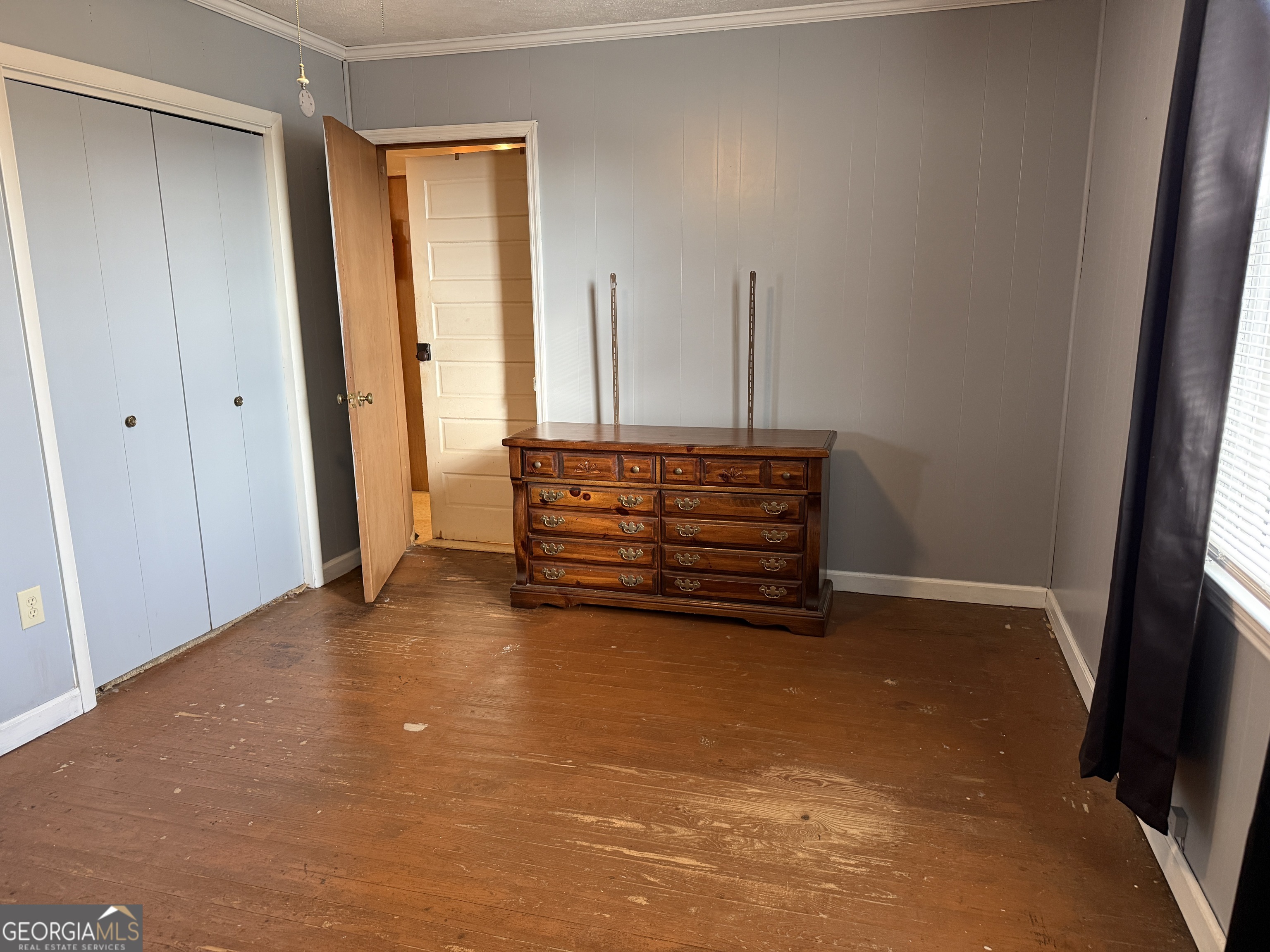 19 Truitt Street Manchester, GA 31816 - Photo 13 of 31 a view of room with wooden floor and window