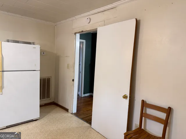 a view of a door and a window