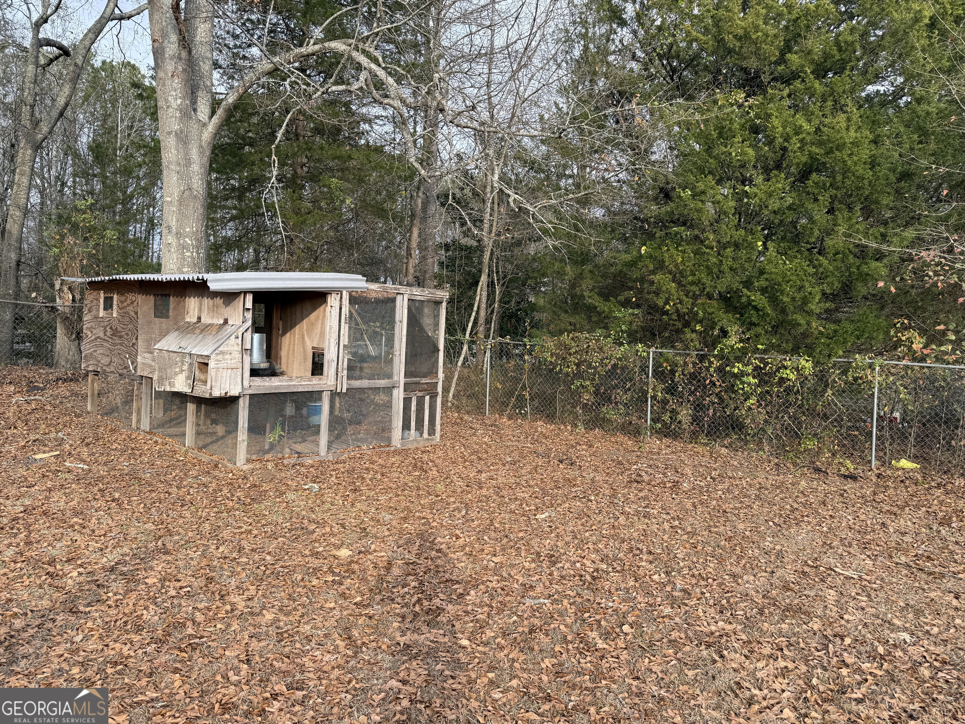 19 Truitt Street Manchester, GA 31816 - Photo 23 of 31 a backyard of a house with table and chairs