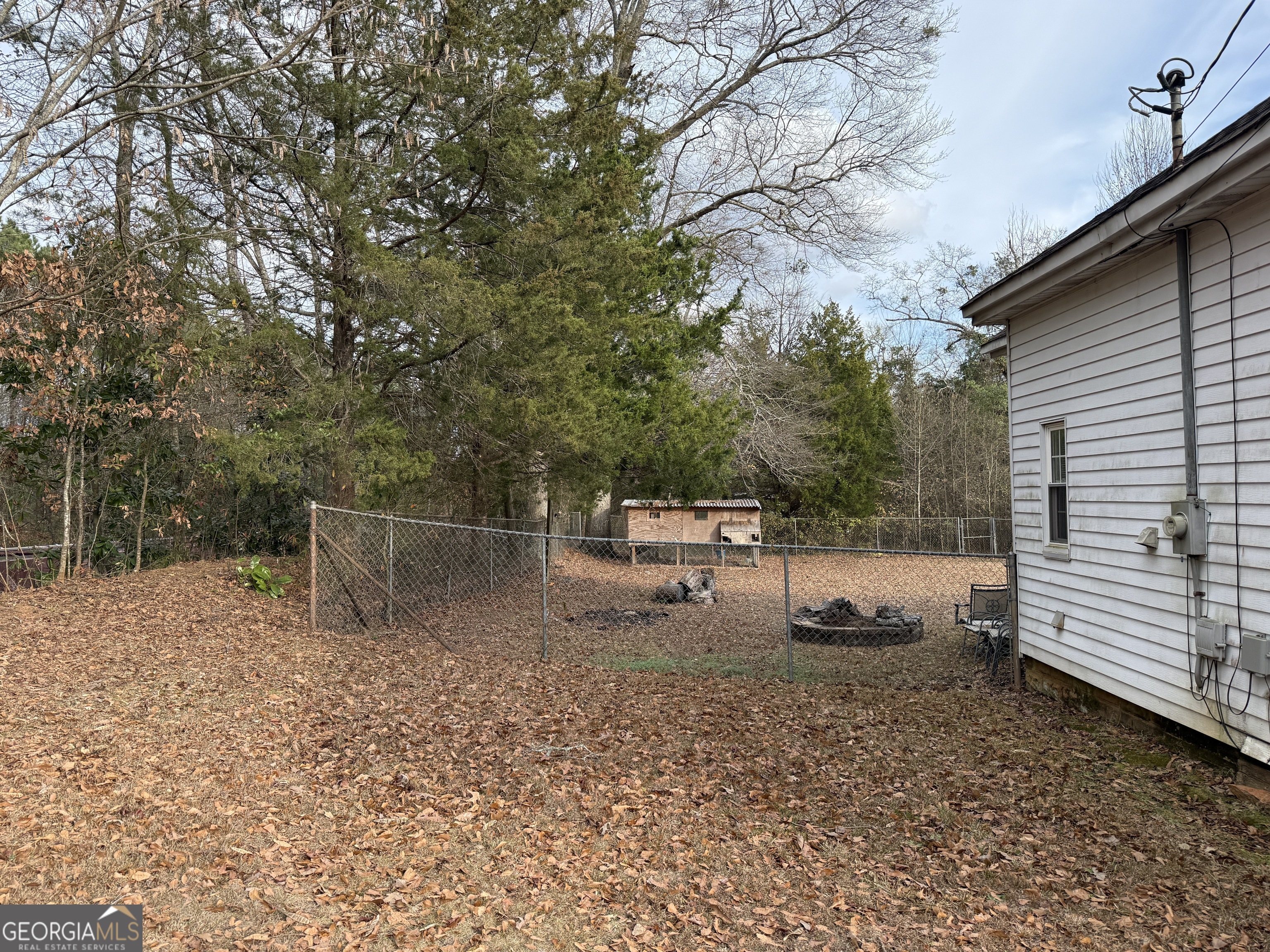 19 Truitt Street Manchester, GA 31816 - Photo 27 of 31 a backyard of a house with barbeque oven