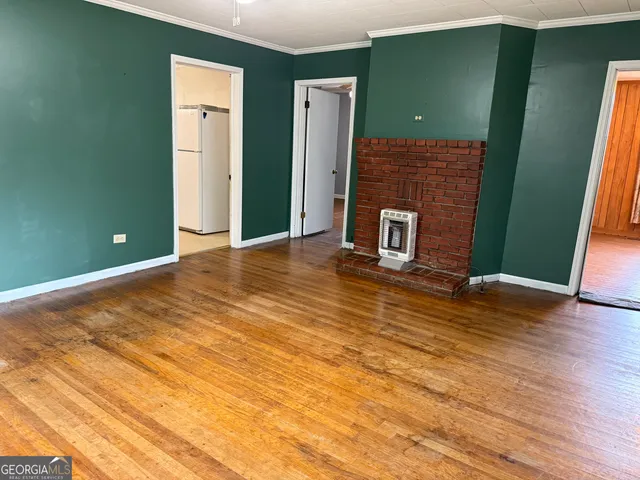 a view of a livingroom with furniture and wooden floor