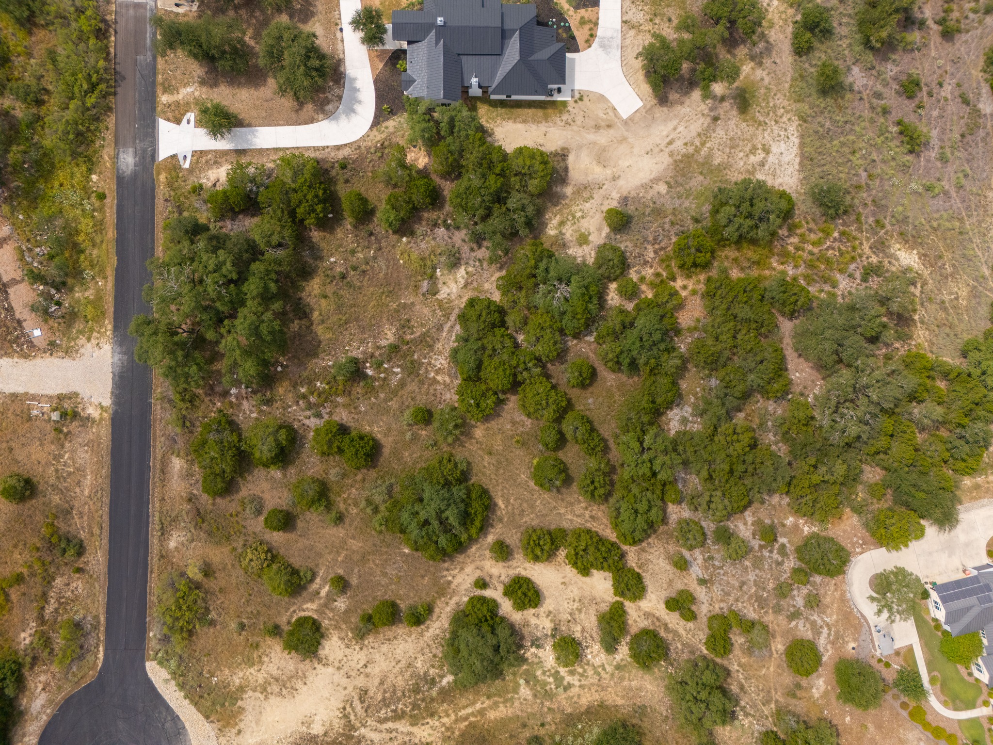 115 Upper River Place Spring Branch, TX 78070 - Photo 8 of 19 An aerial perspective showcases the rolling topography and mature trees across this spacious home site.