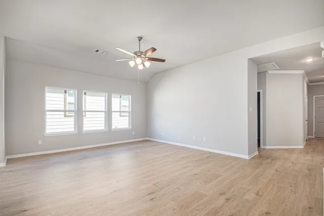 a view of an empty room with a window