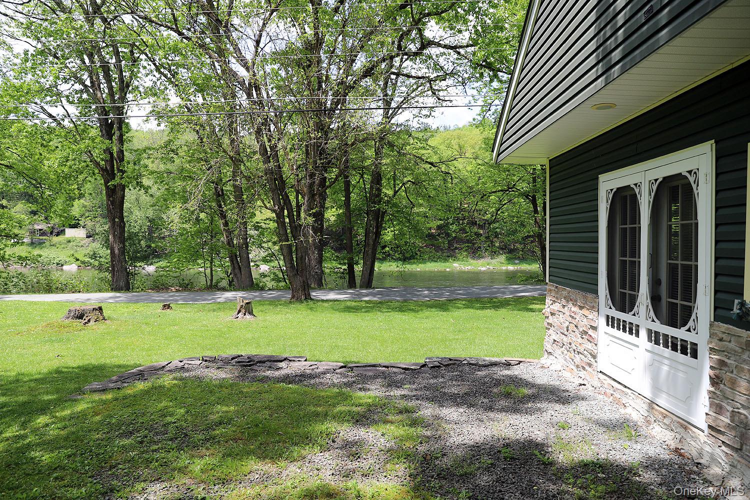 860 River Road Callicoon, NY 12723 - Photo 36 of 45 a view of a backyard with large trees