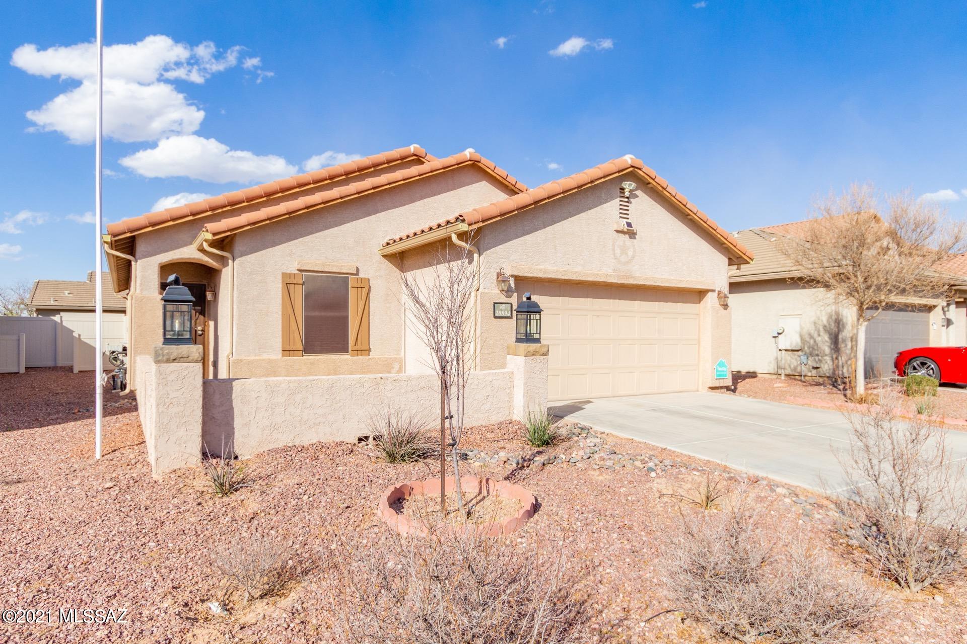 20894 East Founders Road Red Rock, AZ 85145 - Photo 1 of 27 a view of a house with a wooden fence