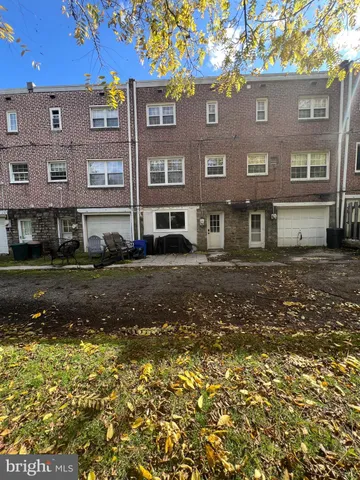 a view of a building with a yard