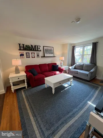 a living room with furniture and a rug
