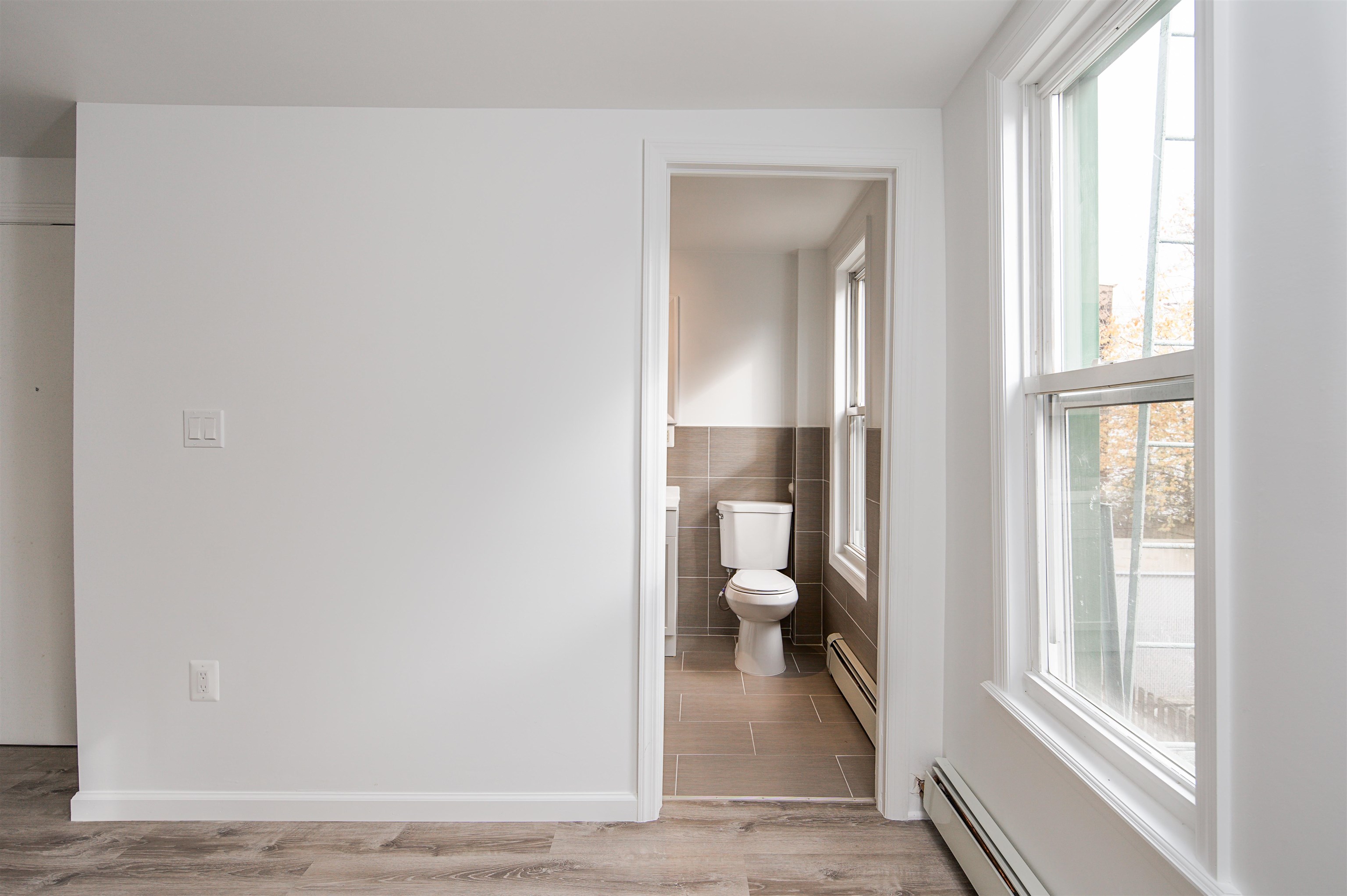 74 Colgate Street, Unit 2 Jersey City, NJ 07302 - Photo 4 of 10 a bathroom with a toilet