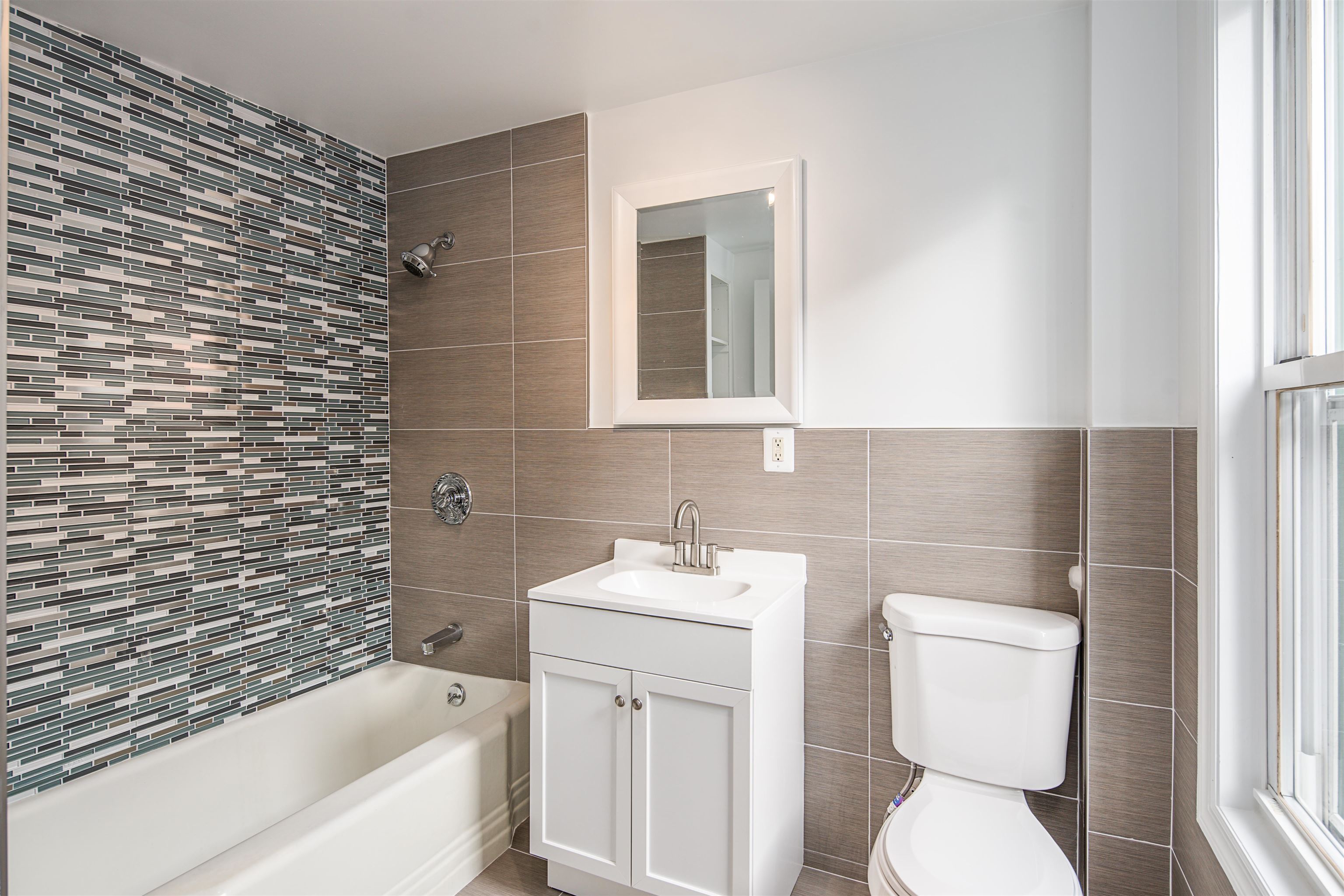 74 Colgate Street, Unit 2 Jersey City, NJ 07302 - Photo 5 of 10 a bathroom with a sink toilet and bathtub