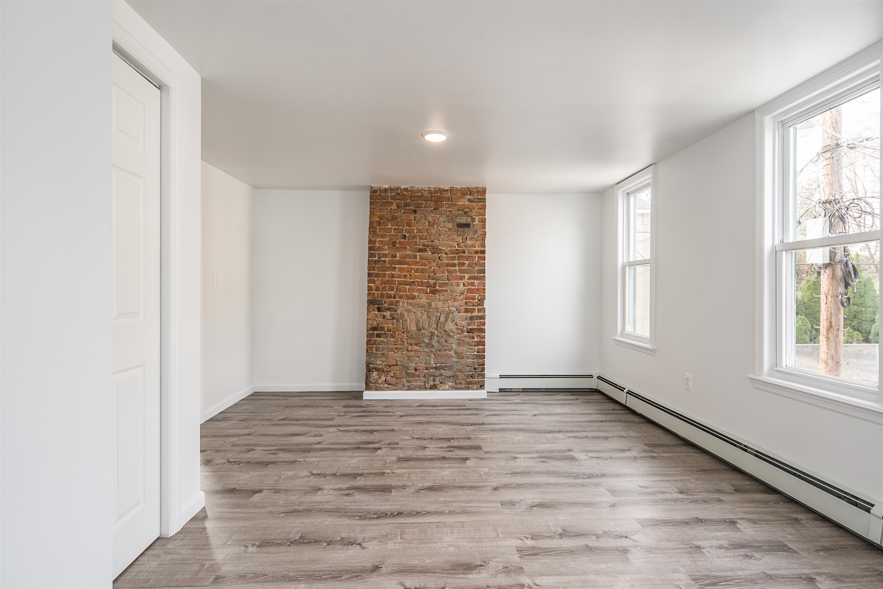 74 Colgate Street, Unit 2 Jersey City, NJ 07302 - Photo 7 of 10 an empty room with windows