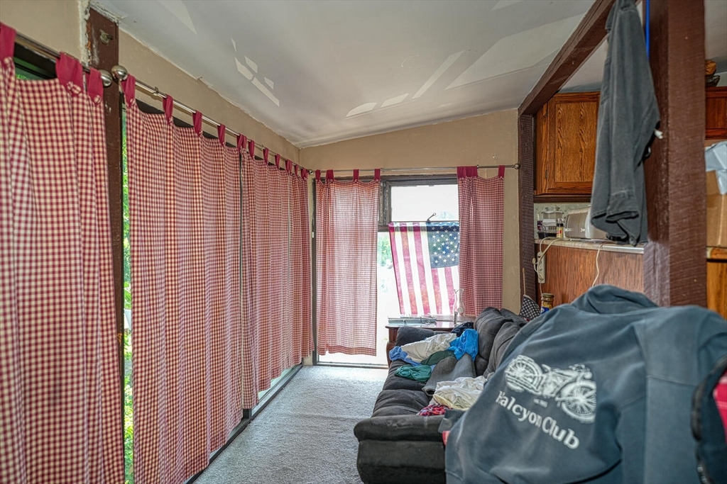 7 Prospect Street Woburn, MA 01801 - Photo 21 of 40 a bed room with a bed and a chair