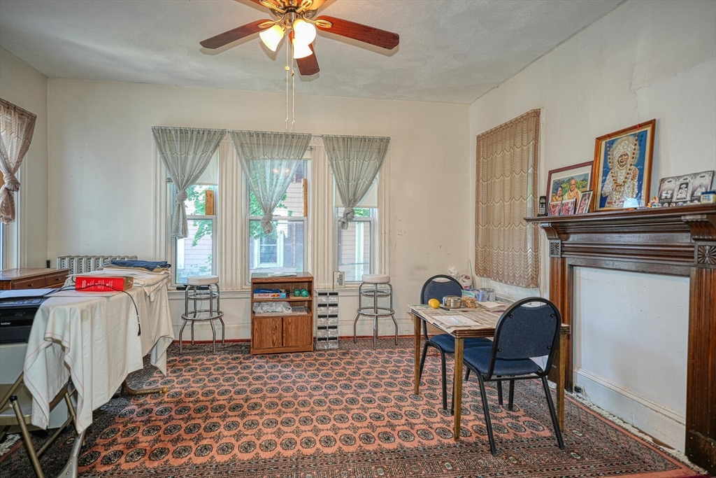 7 Prospect Street Woburn, MA 01801 - Photo 6 of 40 a living room with furniture and a fireplace