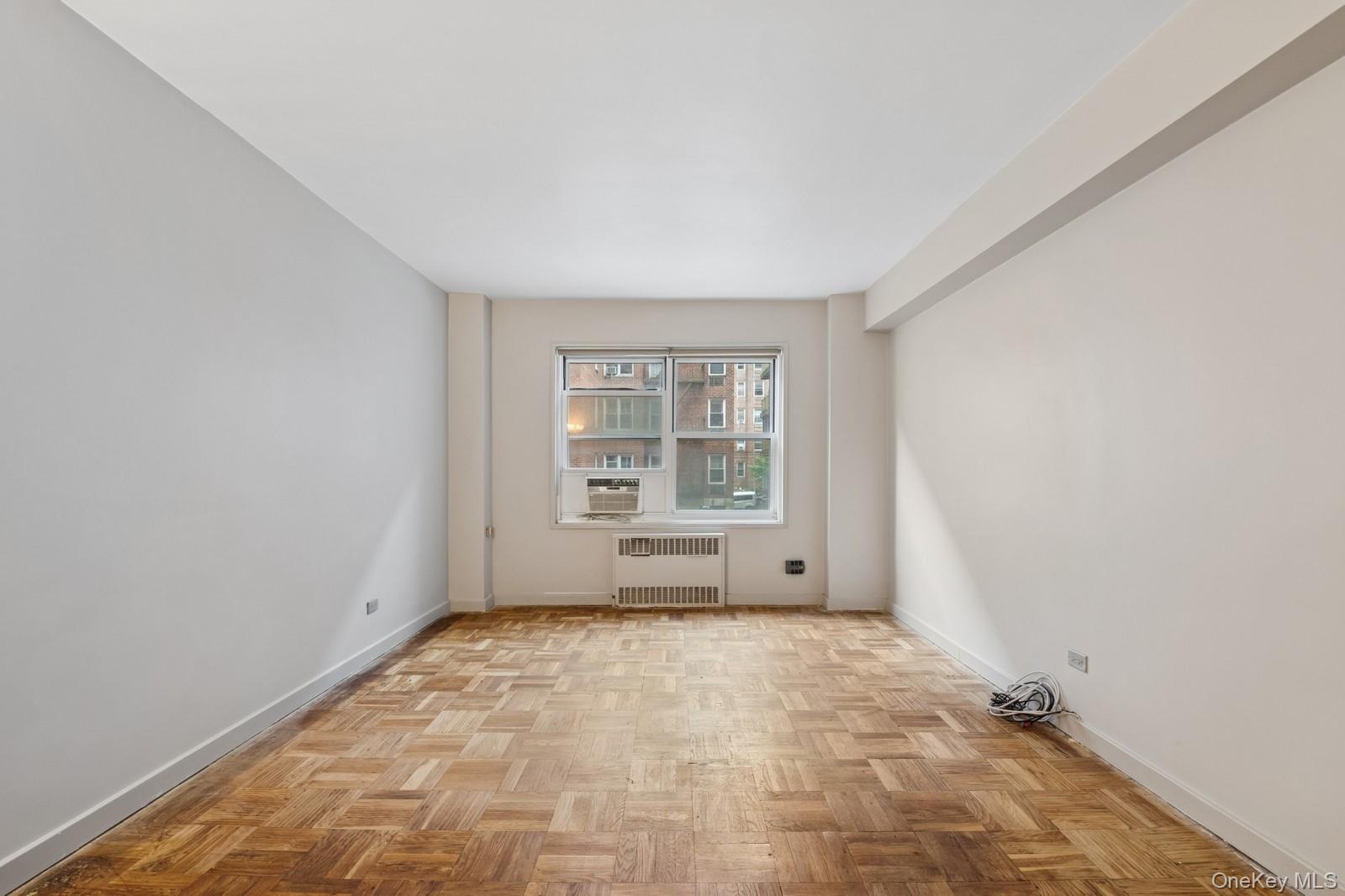 110-20 71st Road, Unit 216 Queens, NY 11375 - Photo 12 of 14 a view of an empty room with a window