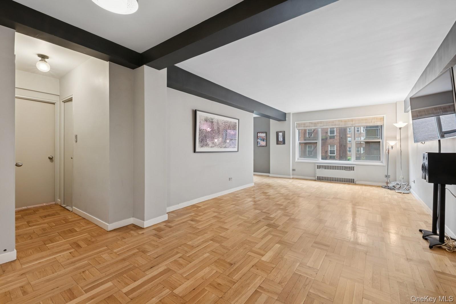 110-20 71st Road, Unit 216 Queens, NY 11375 - Photo 3 of 14 a view of an empty room with a window