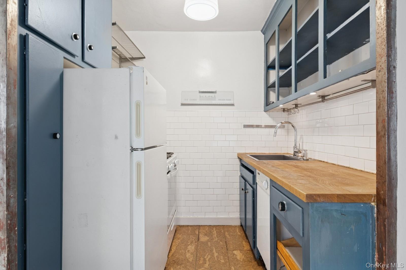 110-20 71st Road, Unit 216 Queens, NY 11375 - Photo 4 of 14 a bathroom with a granite countertop shower and sink