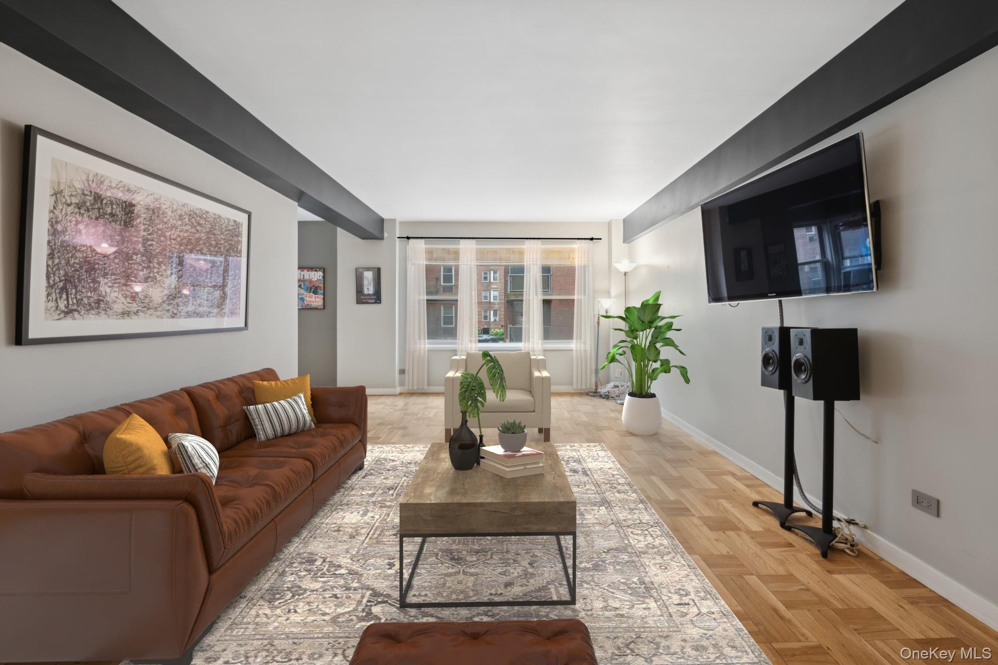 110-20 71st Road, Unit 216 Queens, NY 11375 - Photo 5 of 14 a living room with furniture and a table