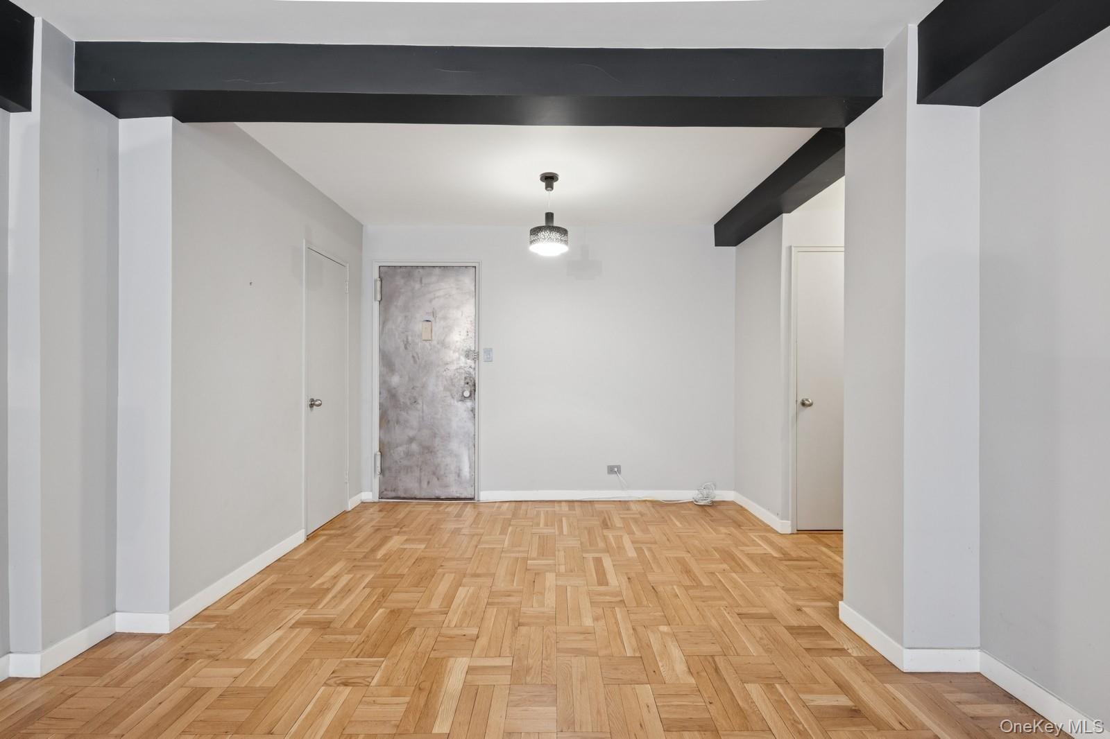 110-20 71st Road, Unit 216 Queens, NY 11375 - Photo 8 of 14 a view of empty room with wooden floor