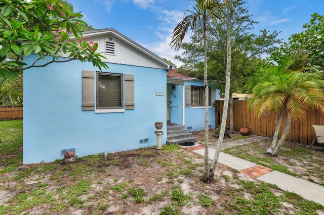 a backyard of a house with seating space