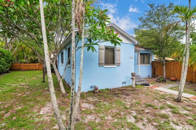 a backyard of a house with seating space