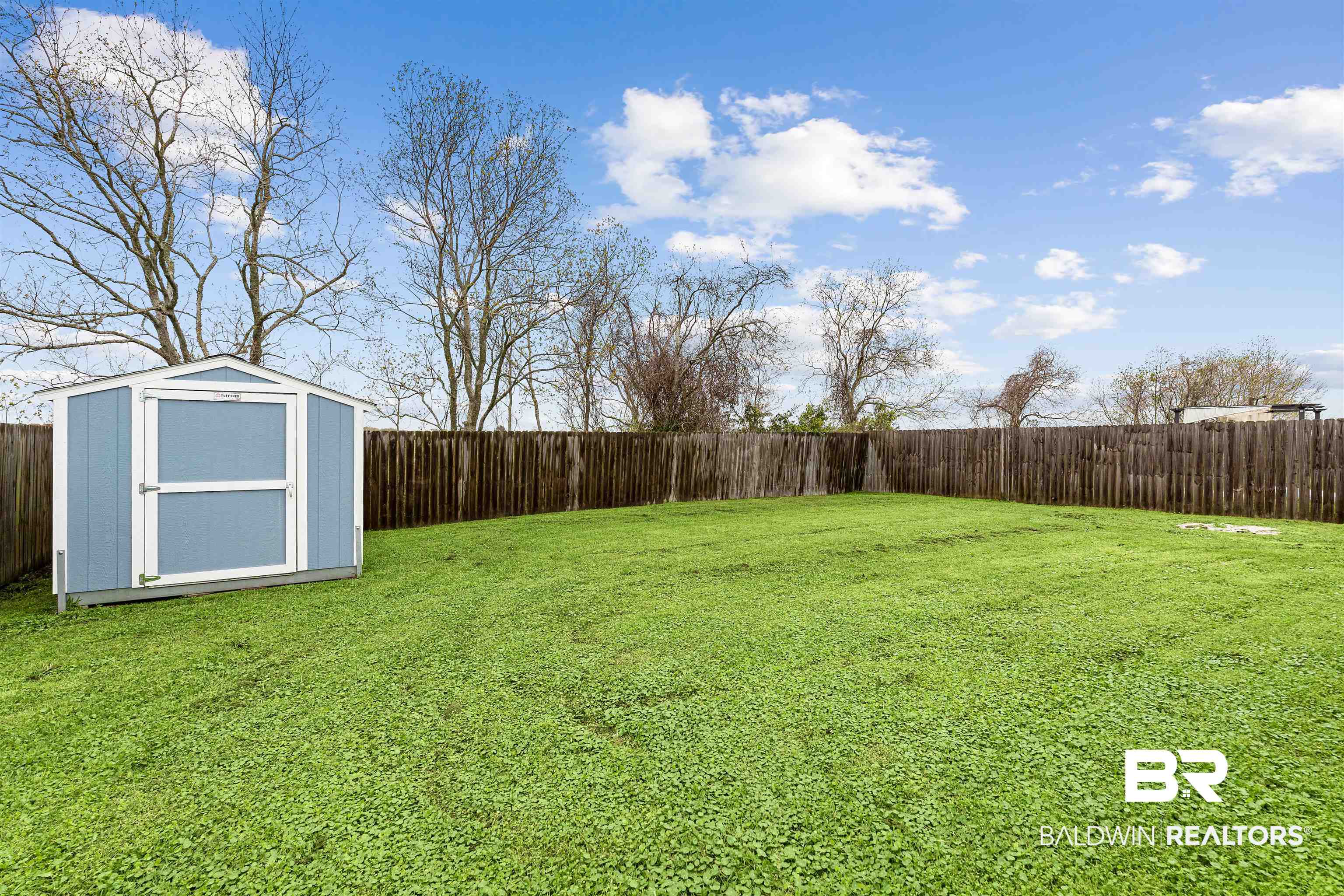 15131 Marem Drive Foley, AL 36535 - Photo 13 of 13 Fenced backyard featuring a shed
