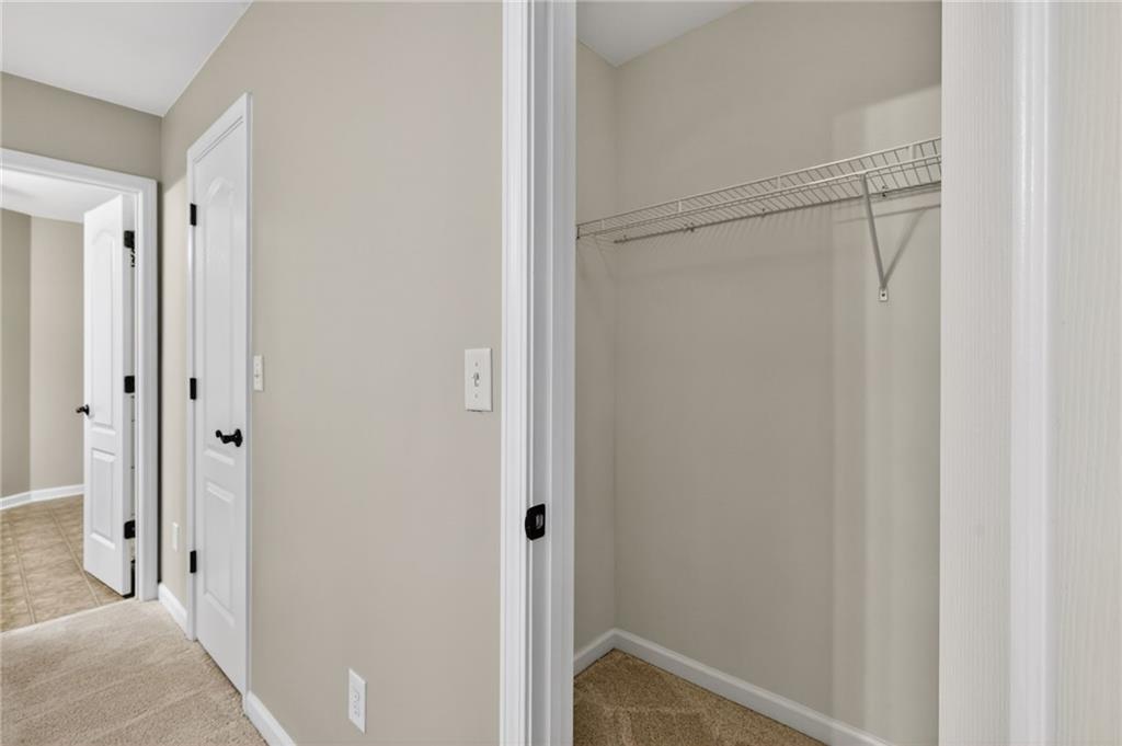 1186 Lake Point Way Suwanee, GA 30024 - Photo 26 of 35 a view of closet area