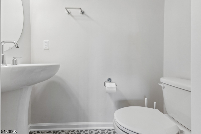 3 Sternadori Road Somerville, NJ 08876 - Photo 9 of 22 a white toilet sitting next to a bathroom sink