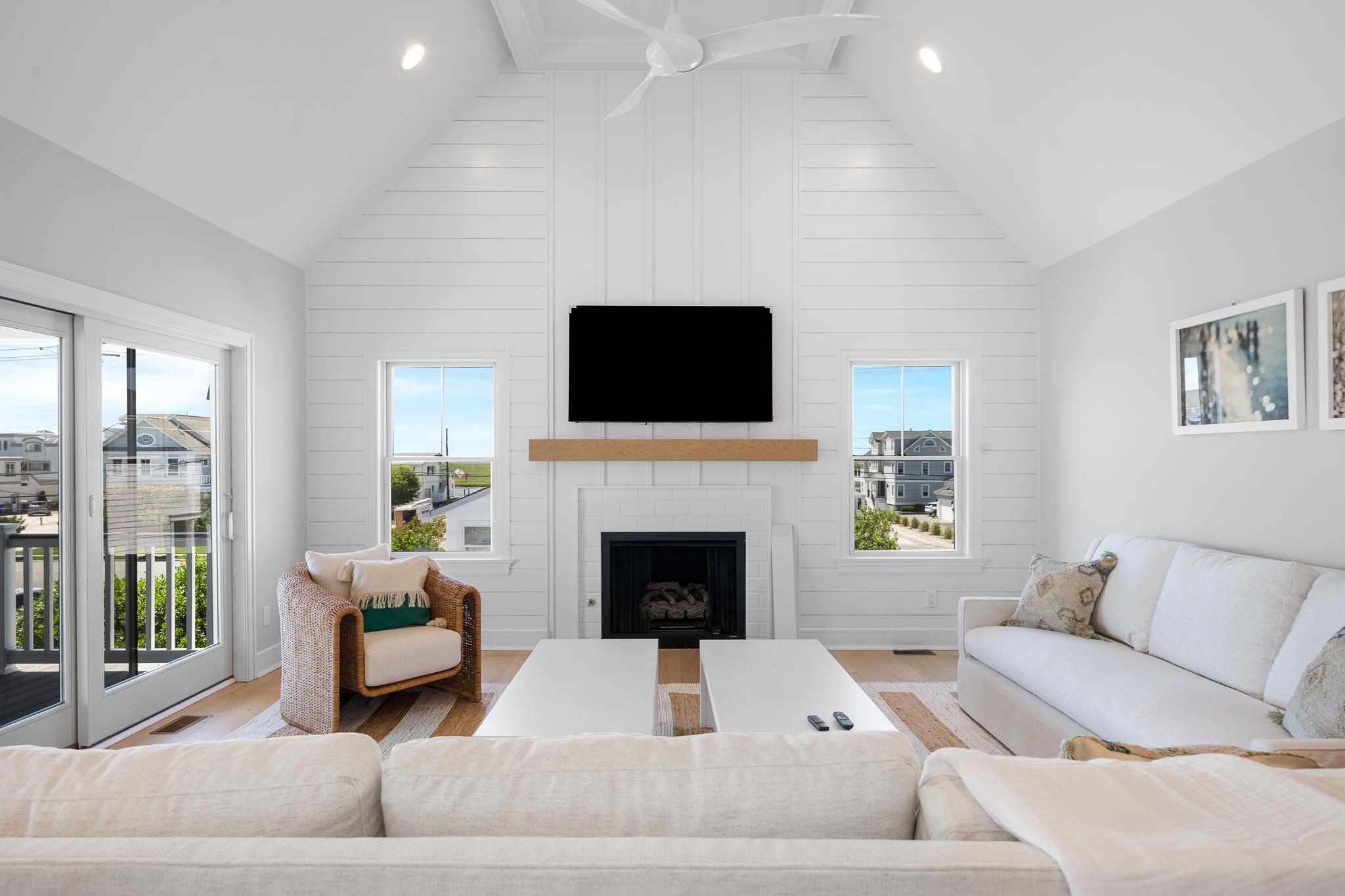 285 58th Street Avalon, NJ 08202 - Photo 22 of 50 a living room with furniture a fireplace and a flat screen tv