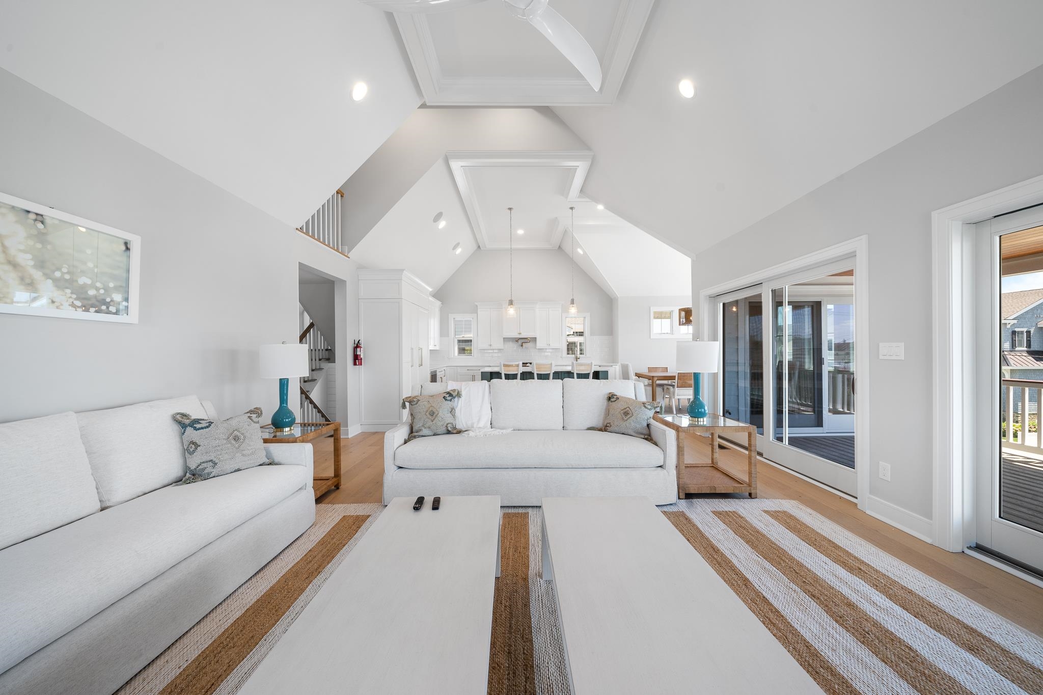 285 58th Street Avalon, NJ 08202 - Photo 24 of 50 a large white room with a large bed and a chandelier