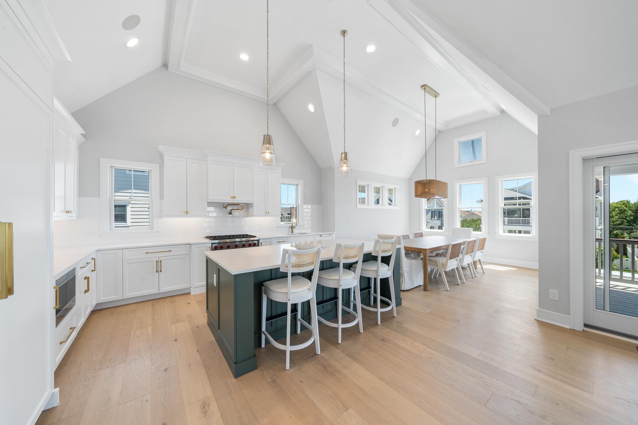 285 58th Street Avalon, NJ 08202 - Photo 27 of 50 a large kitchen with a table and chairs in it