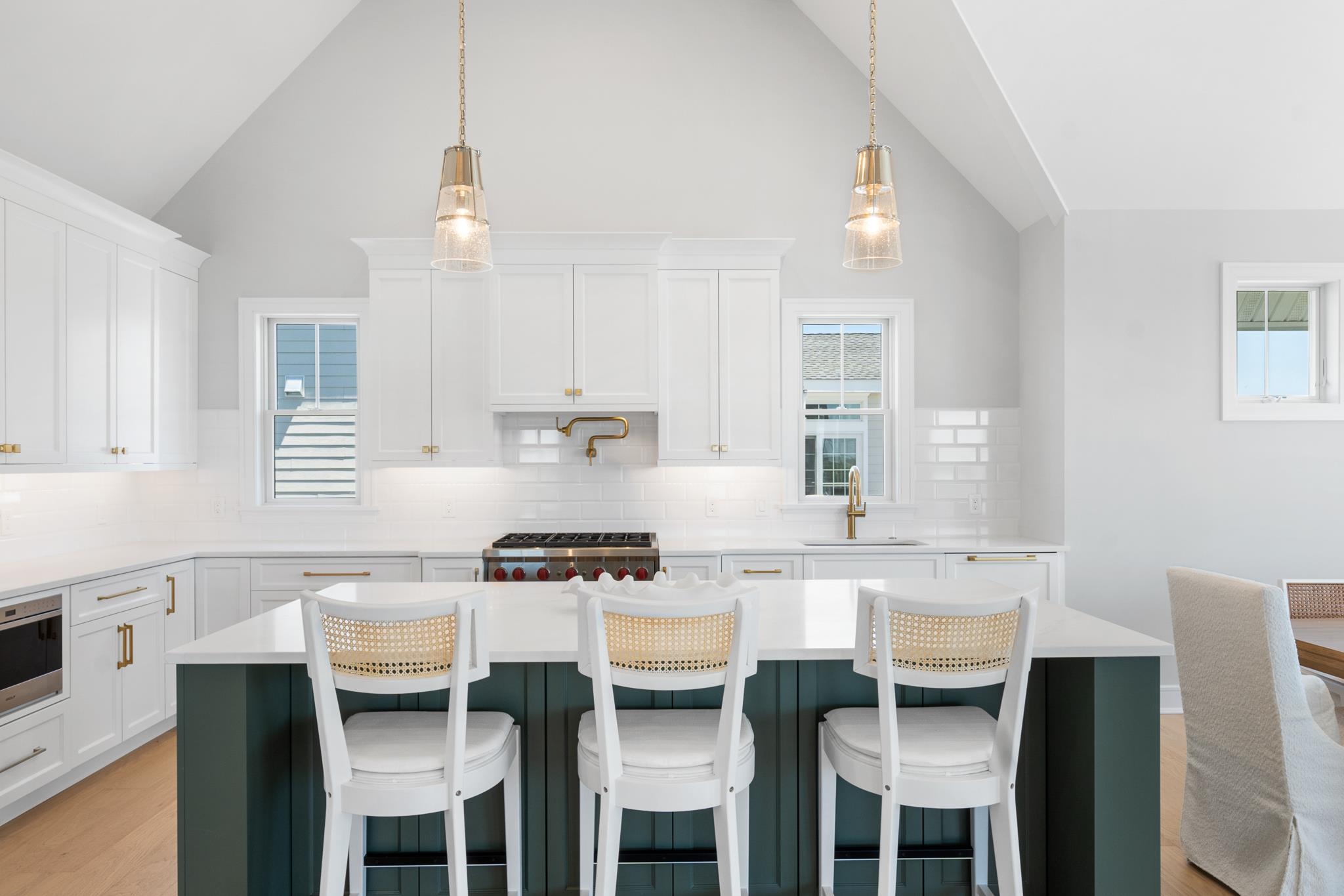 285 58th Street Avalon, NJ 08202 - Photo 29 of 50 a kitchen with stainless steel appliances a stove a table and chairs