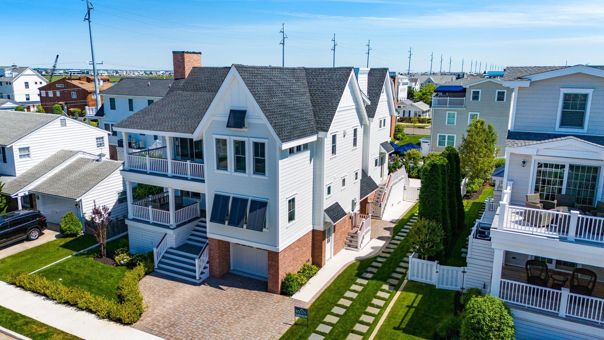 285 58th Street Avalon, NJ 08202 - Photo 3 of 50 a aerial view of a house with a yard and potted plants