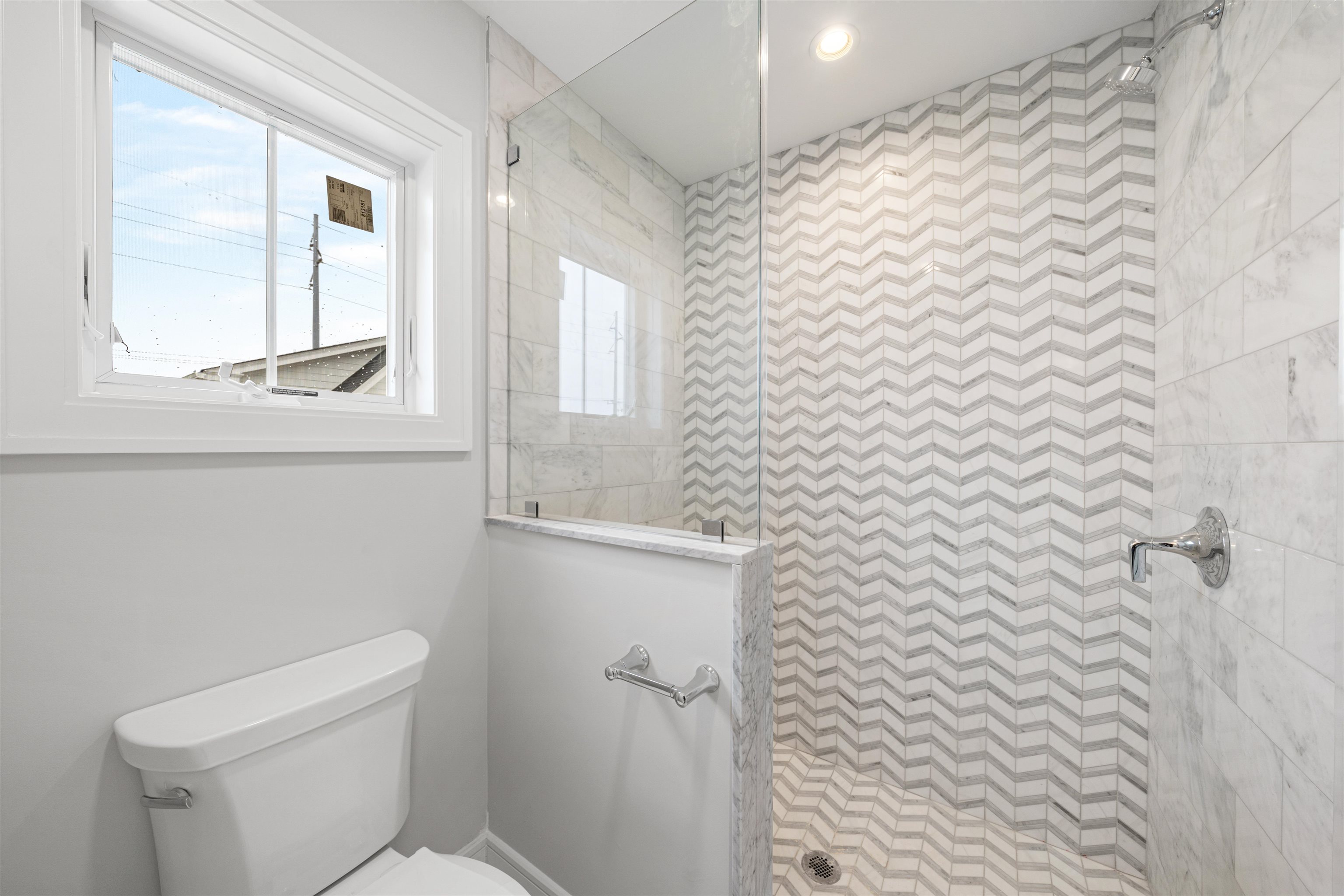 285 58th Street Avalon, NJ 08202 - Photo 36 of 50 a bathroom with a toilet and a shower curtain
