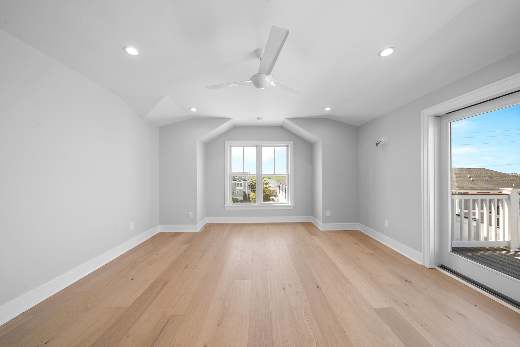 285 58th Street Avalon, NJ 08202 - Photo 39 of 50 wooden floor in an empty room with a window