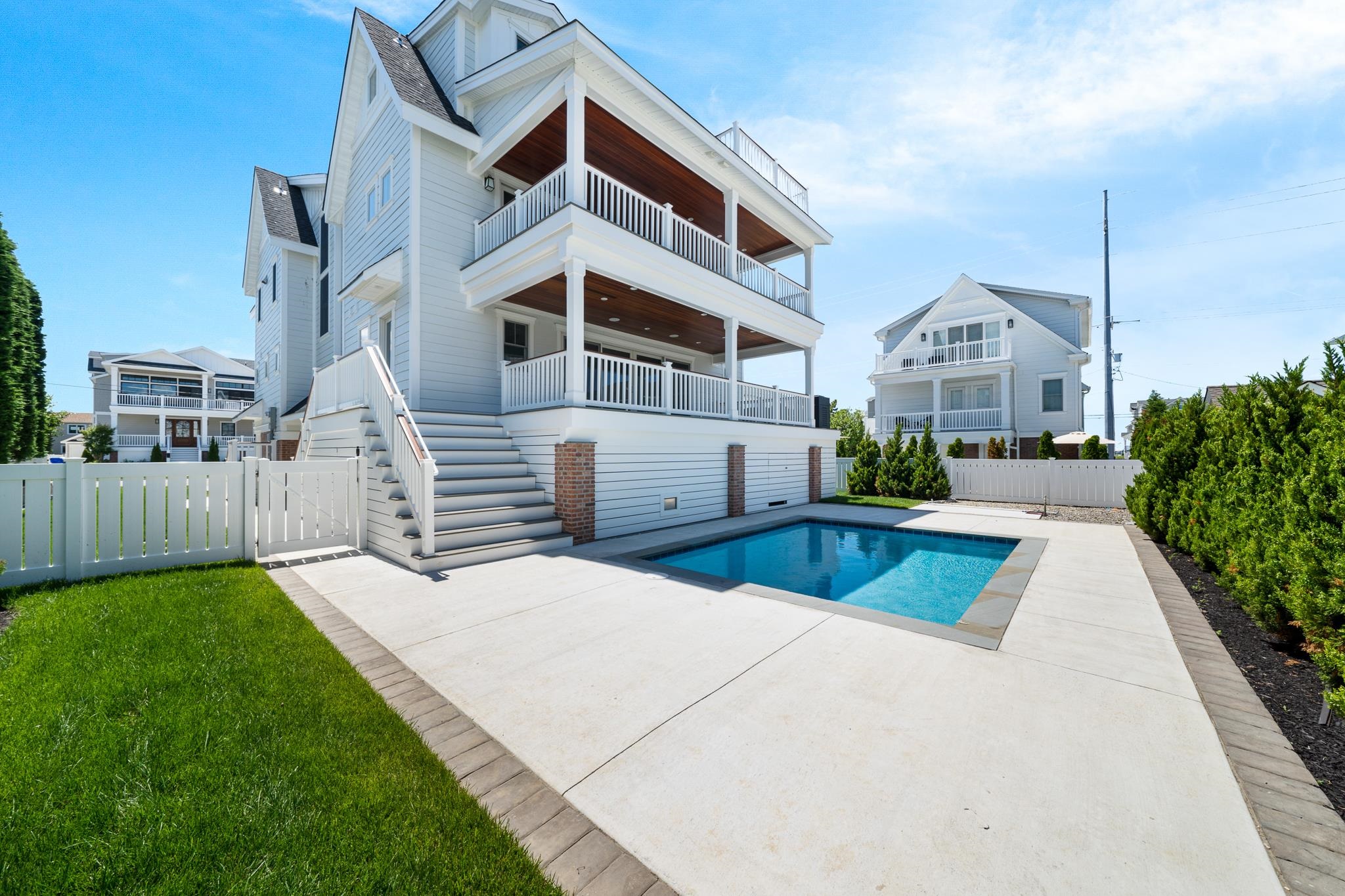 285 58th Street Avalon, NJ 08202 - Photo 7 of 50 a front view of house with yard and green space