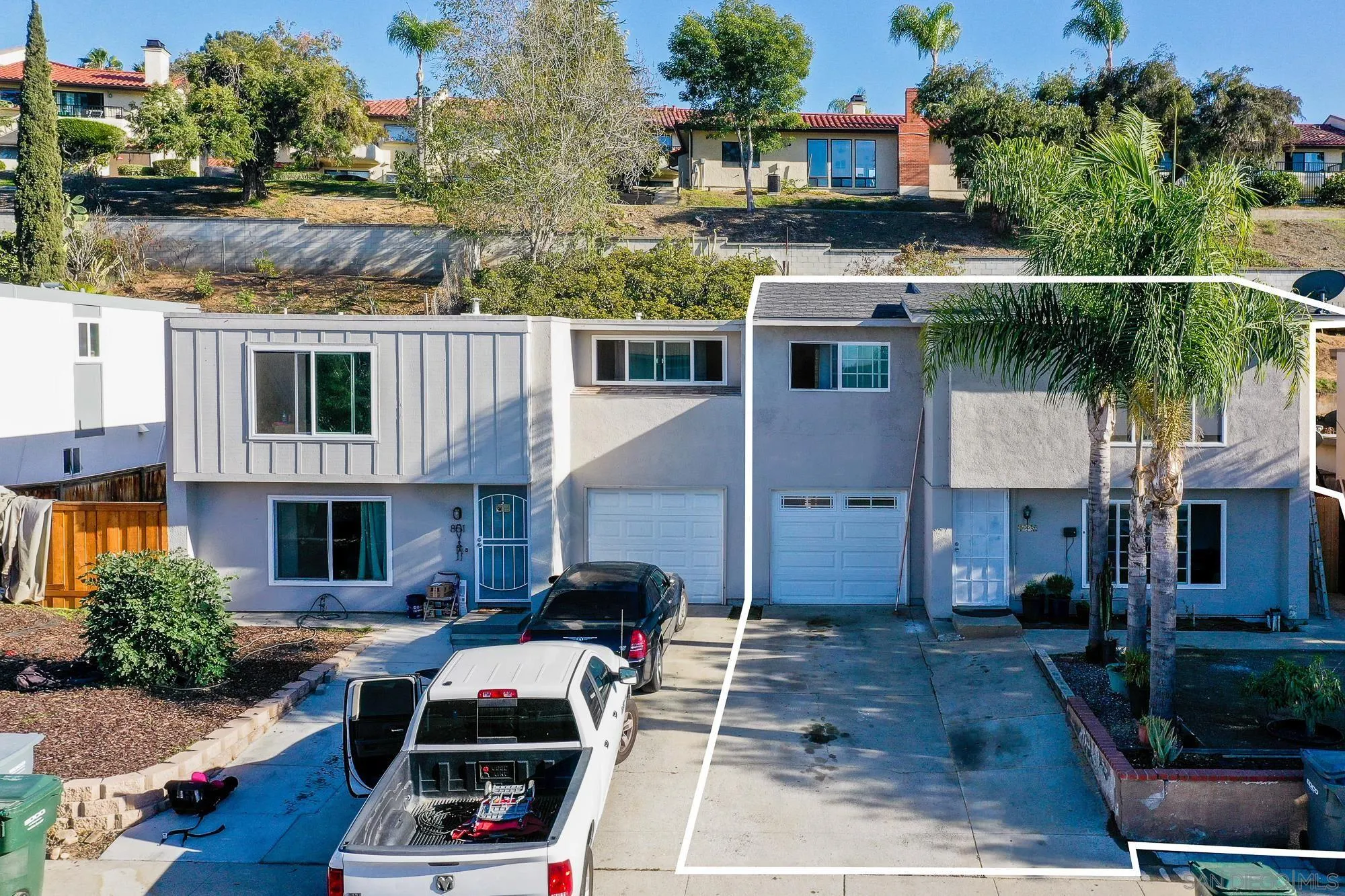 a front view of house with yard outdoor seating and barbeque oven