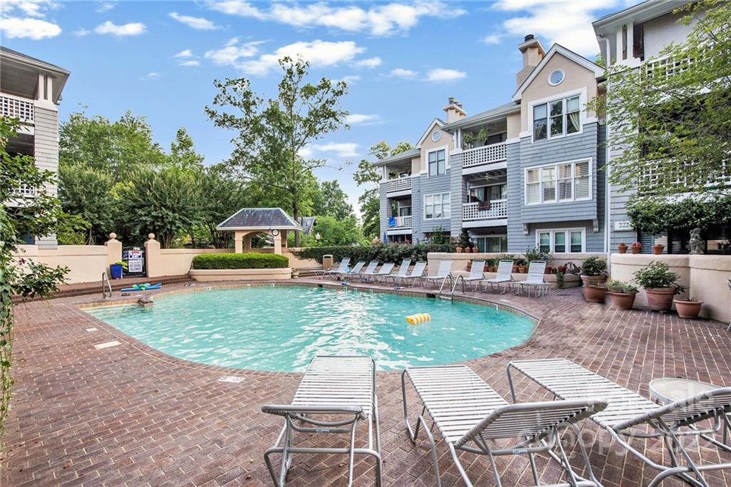 308 Queens Road, Unit 29 Charlotte, NC 28204 - Photo 19 of 20 a view of a house with backyard sitting area and swimming pool