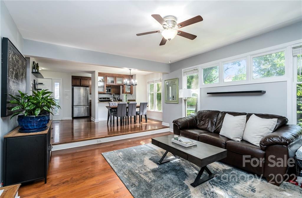 308 Queens Road, Unit 29 Charlotte, NC 28204 - Photo 8 of 20 a living room with furniture potted plant and a window