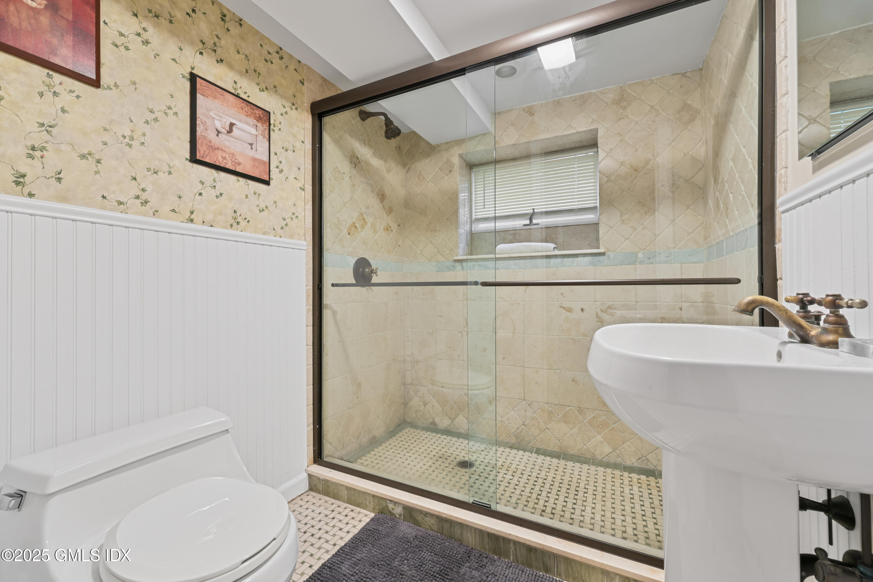 3 Janet Court, Unit 2 Riverside, CT 06878 - Photo 12 of 22 a bathroom with a sink toilet and shower