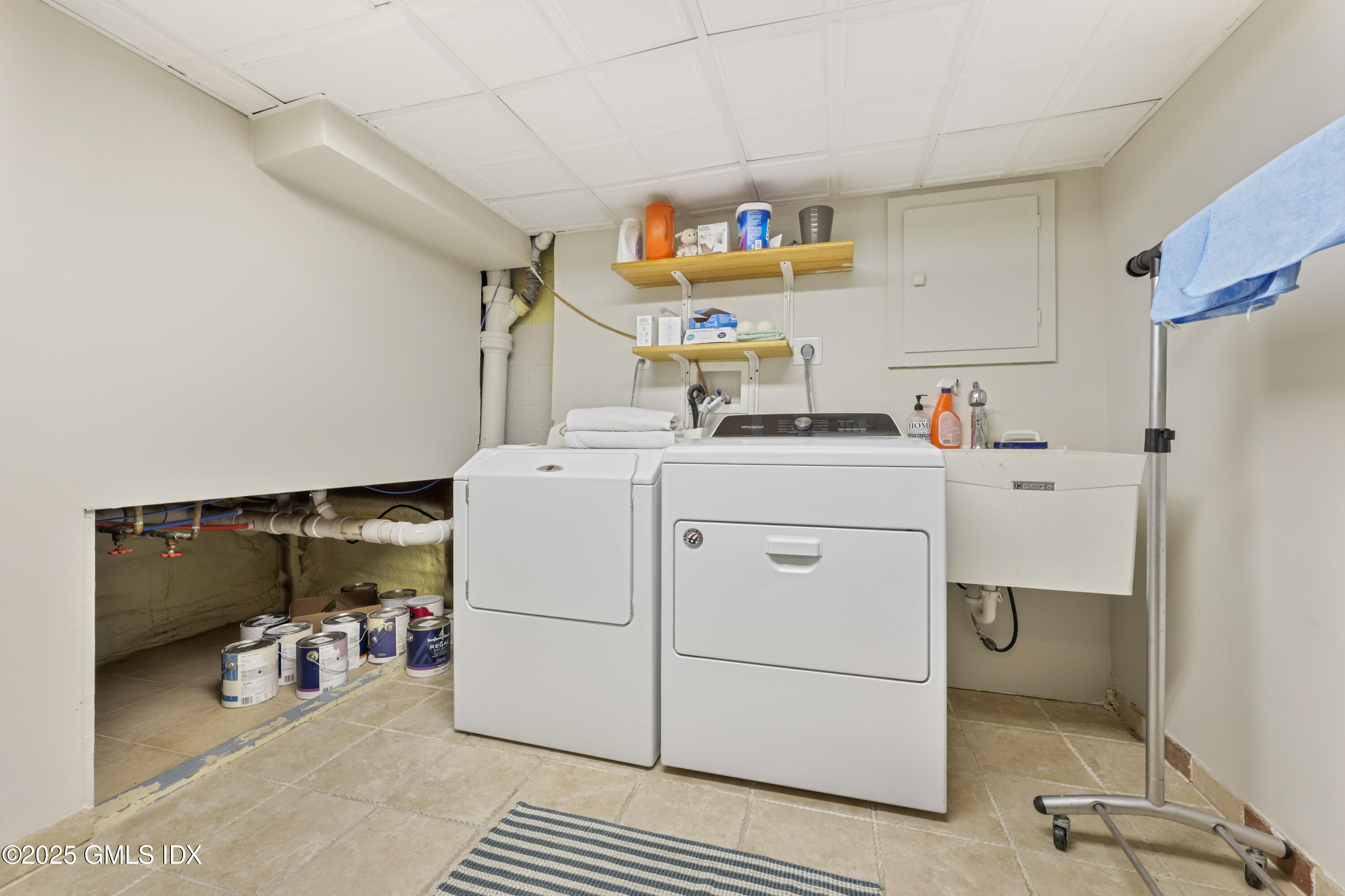3 Janet Court, Unit 2 Riverside, CT 06878 - Photo 15 of 22 a utility room with cabinets washer and dryer
