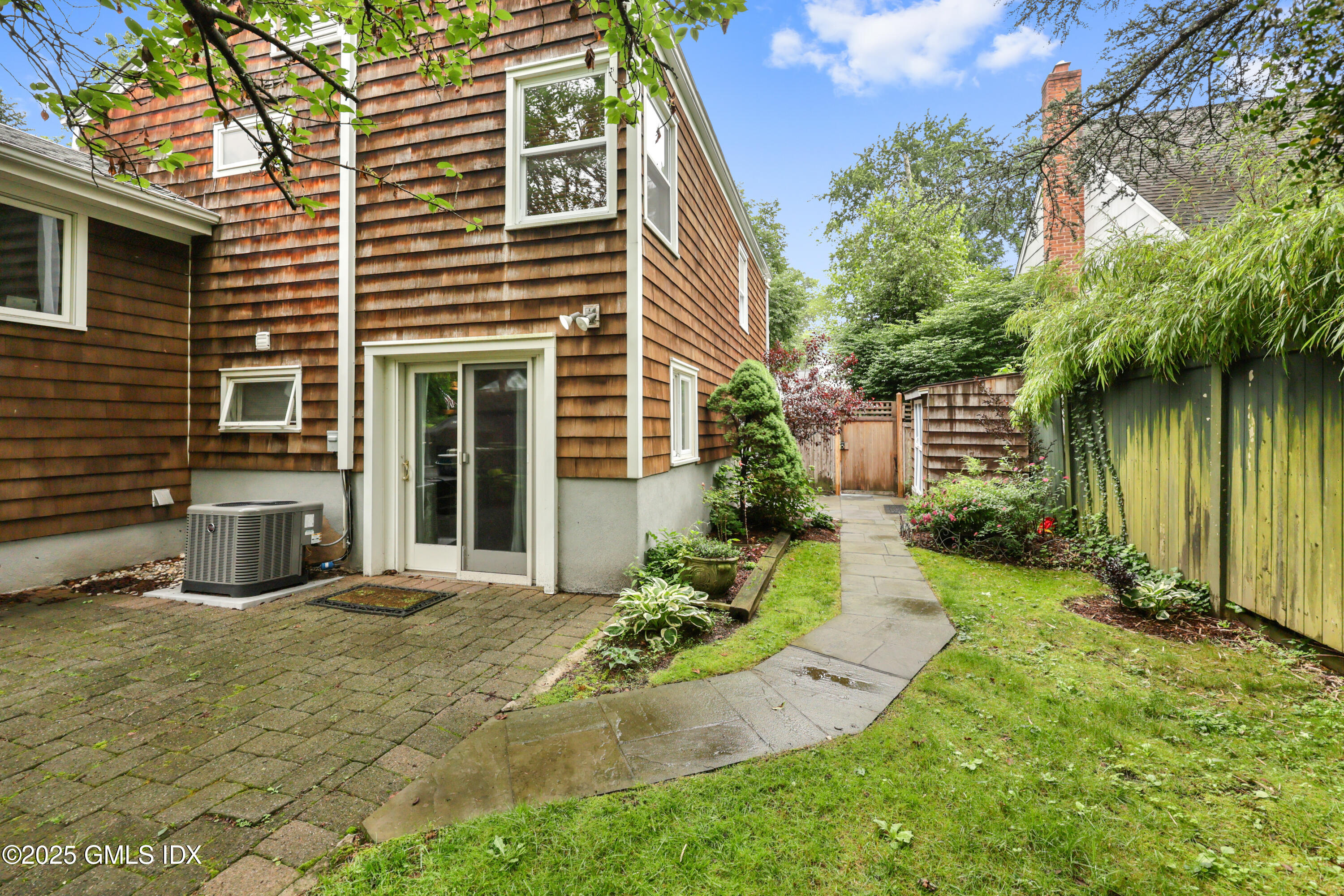 3 Janet Court, Unit 2 Riverside, CT 06878 - Photo 18 of 22 a view of a house with backyard and sitting area